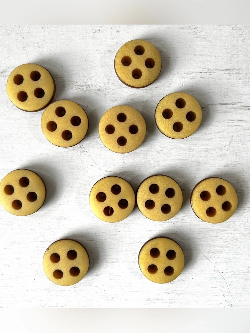 11 Unusual Vintage Round Plastic 4 hole Buttons w Groove Offbeat Yellow Ochre